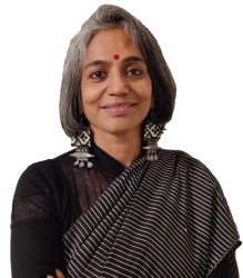 image of Ar. Gita in black sari and red bindi