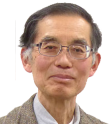 Image of Dr. Satoshi. An elderly man wearing specs and brown color coat with a white shirt