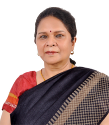 Ms. Stuti Kacker is wearing a black and beige checkered saree with a red blouse.