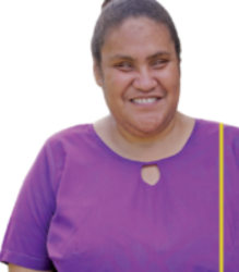 Ms. Sovaia, is wearing a purple top with a yellow sling bag and a neat bun.