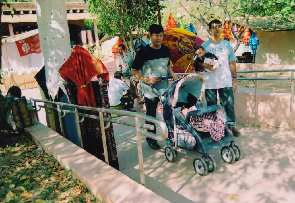 A wheelchair user using a ramp in the market