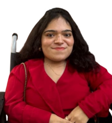 Alviya wearing a red dress and smiling