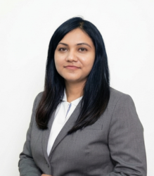 Rajvii Mehta wearing grey and white attire